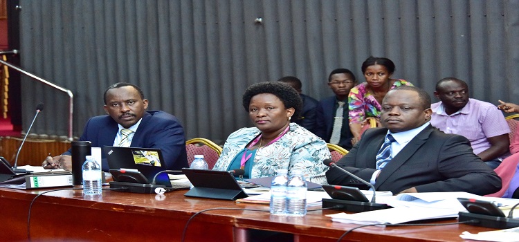 Commissioner General, Musinguzi (L) appearing before Cosase with other officials from URA